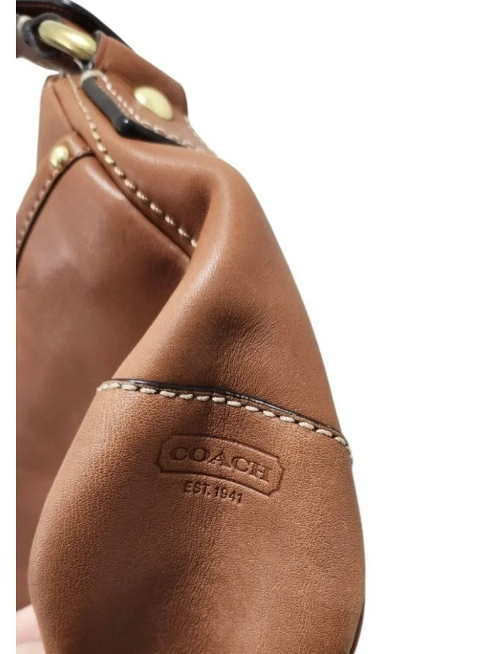 Coach details brand